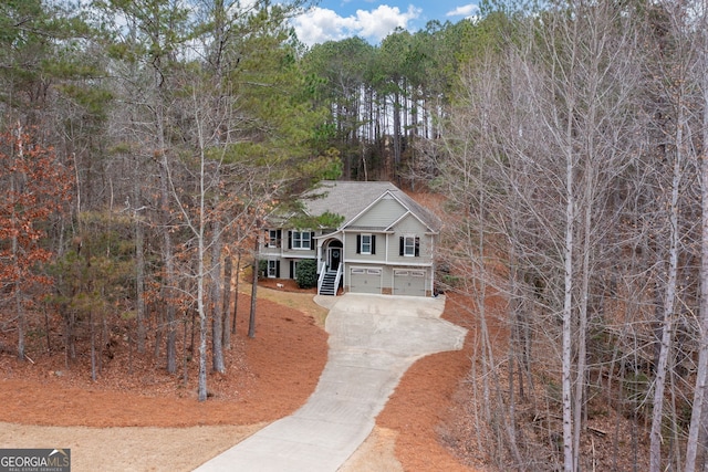 view of front facade featuring covered porch and a garage