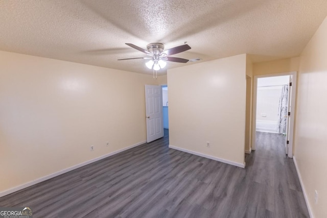 spare room featuring a textured ceiling, ceiling fan, and dark hardwood / wood-style floors