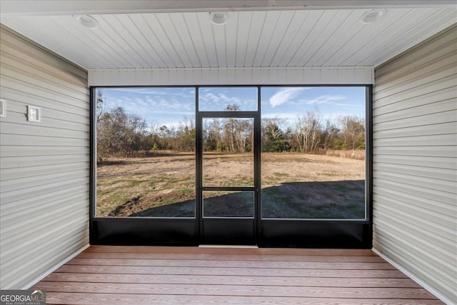 unfurnished sunroom featuring a wealth of natural light