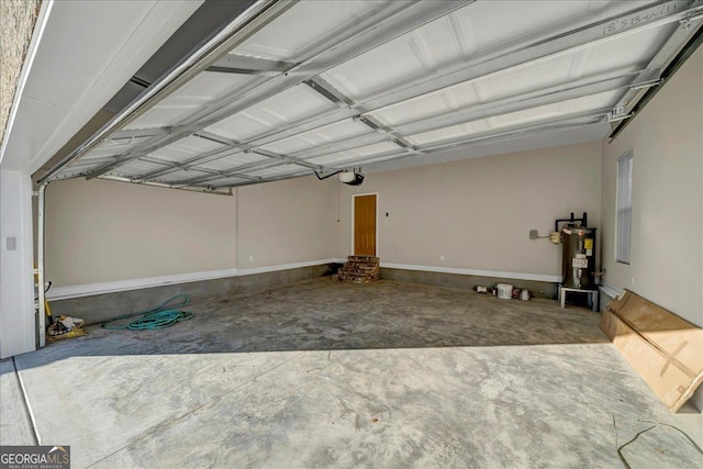 garage featuring electric water heater and a garage door opener