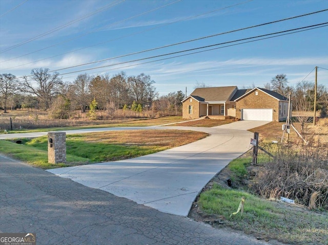 view of front facade with a front lawn and a garage