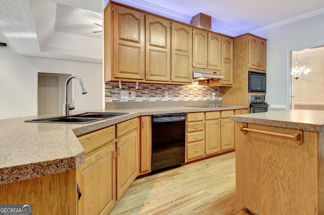 kitchen featuring backsplash, black appliances, sink, light wood-type flooring, and a chandelier