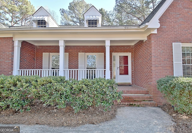 doorway to property with covered porch