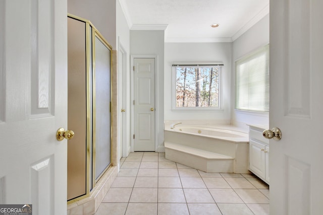 bathroom featuring tile patterned floors, ornamental molding, and separate shower and tub