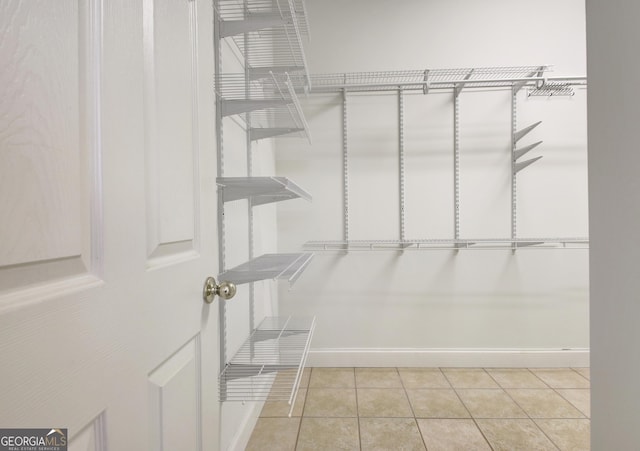 walk in closet featuring light tile patterned floors