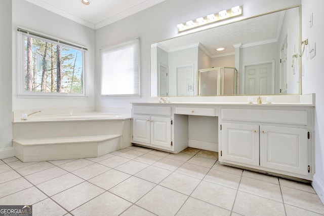 bathroom featuring plus walk in shower, ornamental molding, tile patterned floors, and vanity