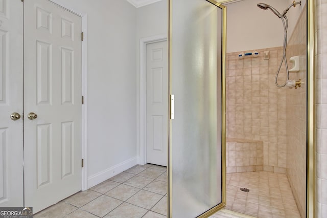 bathroom featuring an enclosed shower and tile patterned floors