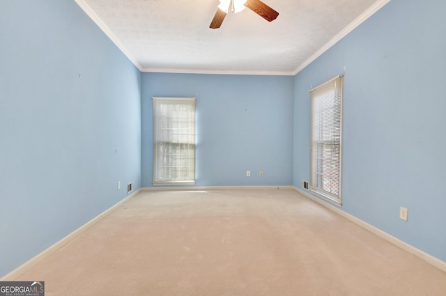 empty room with light carpet, ceiling fan, and ornamental molding