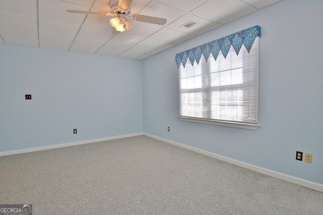 unfurnished room with carpet, a paneled ceiling, and ceiling fan