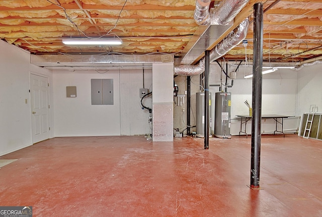 basement featuring water heater and electric panel