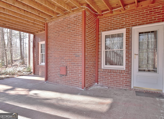 property entrance featuring a patio