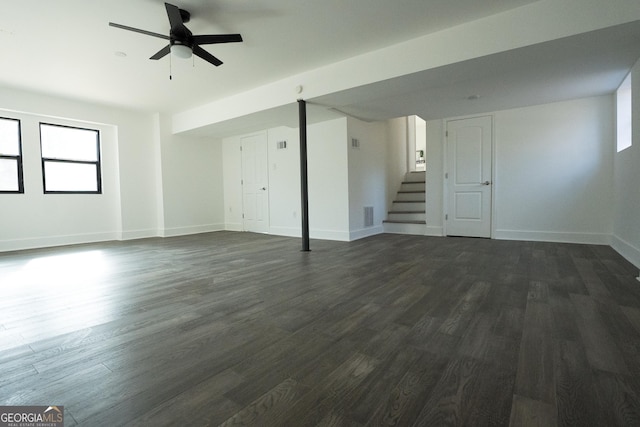 spare room featuring ceiling fan and dark hardwood / wood-style flooring