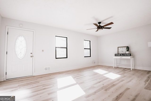 foyer entrance with light hardwood / wood-style floors and ceiling fan