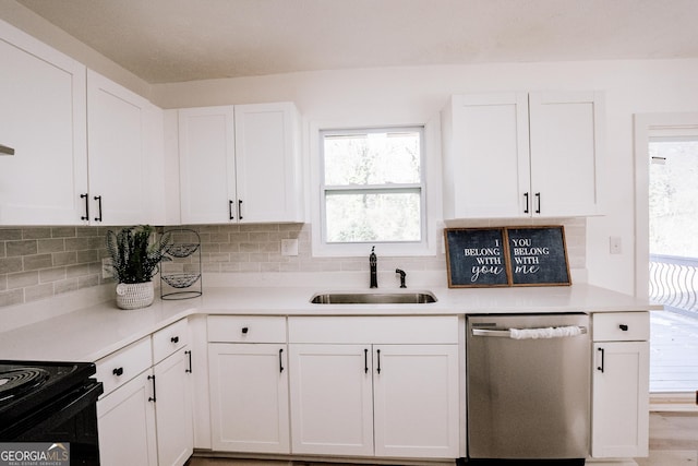 kitchen featuring white cabinetry, dishwasher, backsplash, and sink