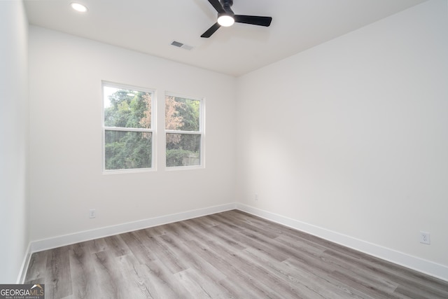 unfurnished room with ceiling fan and light hardwood / wood-style flooring