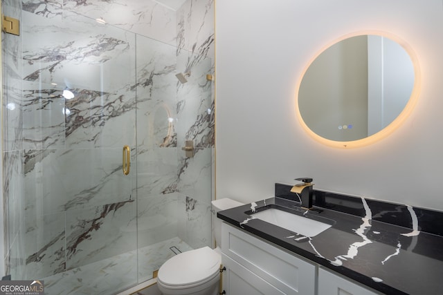 bathroom with an enclosed shower, vanity, and toilet