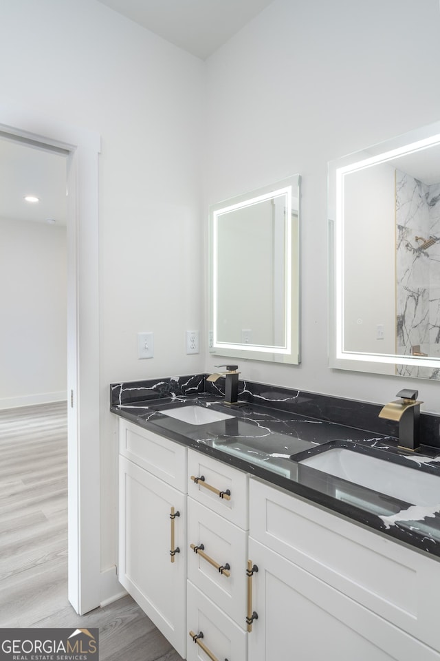 bathroom with wood-type flooring and vanity