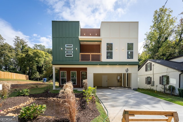 back of property featuring a balcony