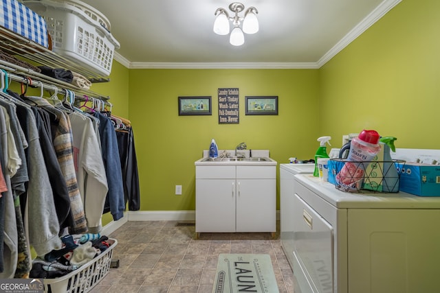 clothes washing area featuring separate washer and dryer, cabinets, a notable chandelier, ornamental molding, and sink