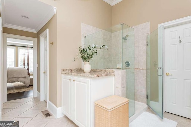 bathroom with crown molding, walk in shower, and tile patterned floors