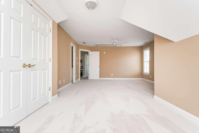 interior space featuring ceiling fan