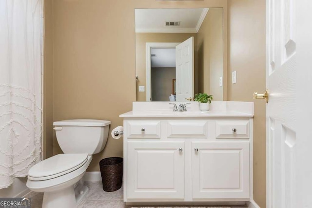 bathroom featuring toilet, vanity, tile patterned floors, and crown molding