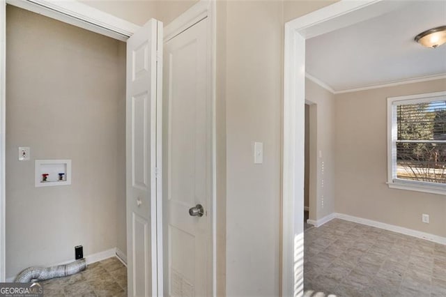 washroom featuring hookup for a washing machine and ornamental molding