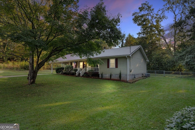 exterior space featuring a yard and covered porch