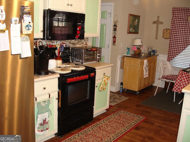 kitchen featuring black appliances, dark hardwood / wood-style flooring, white cabinets, and tasteful backsplash