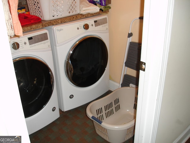 clothes washing area featuring washing machine and clothes dryer