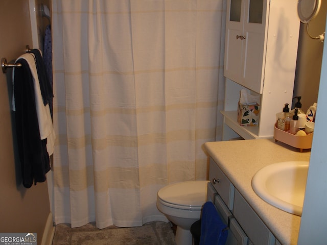 bathroom with toilet and vanity