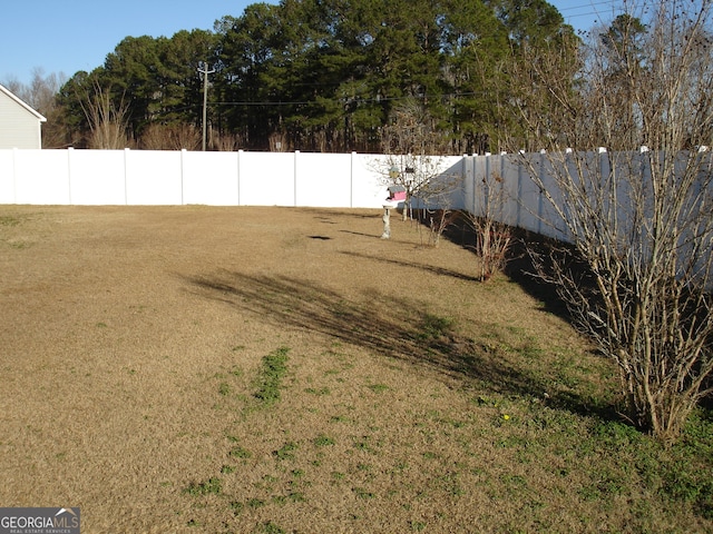 view of yard featuring a fenced backyard