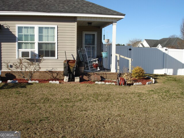 exterior space with a lawn and cooling unit