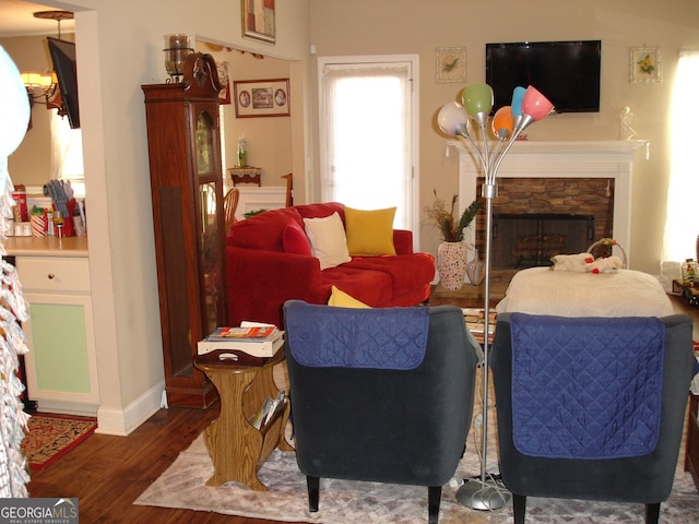 living room featuring dark hardwood / wood-style floors and a fireplace