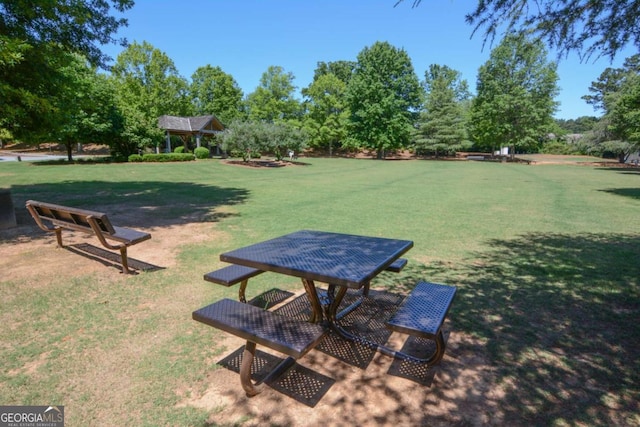 surrounding community featuring a gazebo and a yard