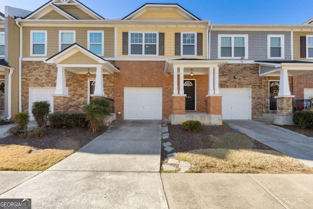 townhome / multi-family property featuring a garage