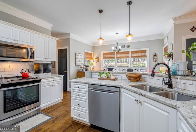 1231 Scarlet Oak Cir, Athens, GA 30606 - kitchen featuring stainless steel appliances, a sink, decorative backsplash, white cabinetry, and crown molding