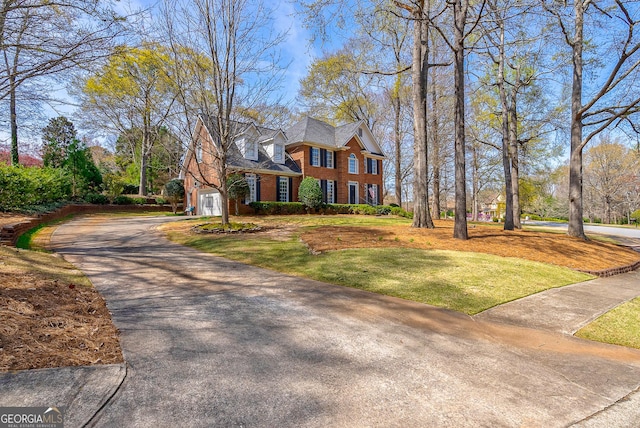 1231 Scarlet Oak Cir, Athens, GA 30606 - view of front facade featuring driveway, brick siding, a front yard, and a garage