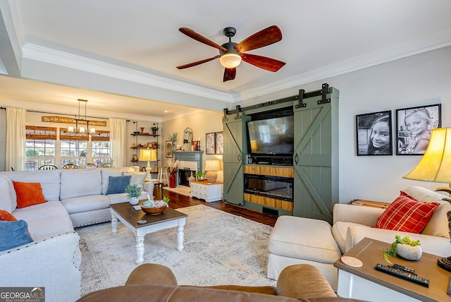 1231 Scarlet Oak Cir, Athens, GA 30606 - living room with a barn door, ceiling fan, ornamental molding, and wood finished floors