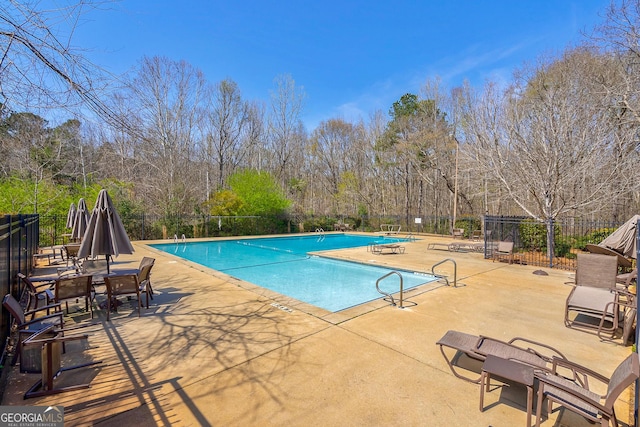 1231 Scarlet Oak Cir, Athens, GA 30606 - community pool with a patio and view of wooded area