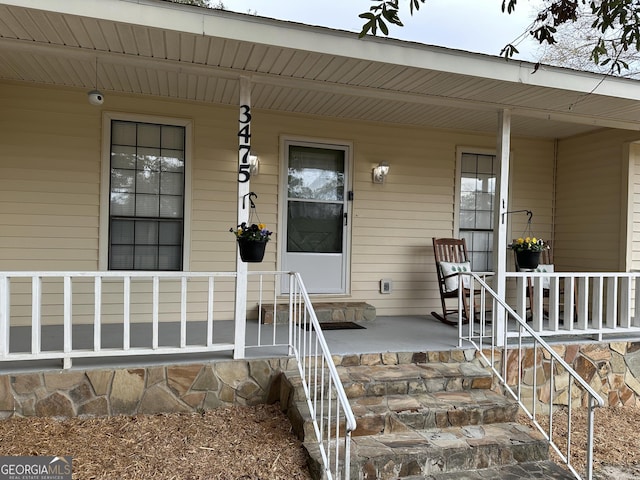 doorway to property with a porch