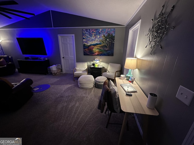 carpeted living room featuring ceiling fan, vaulted ceiling, and crown molding