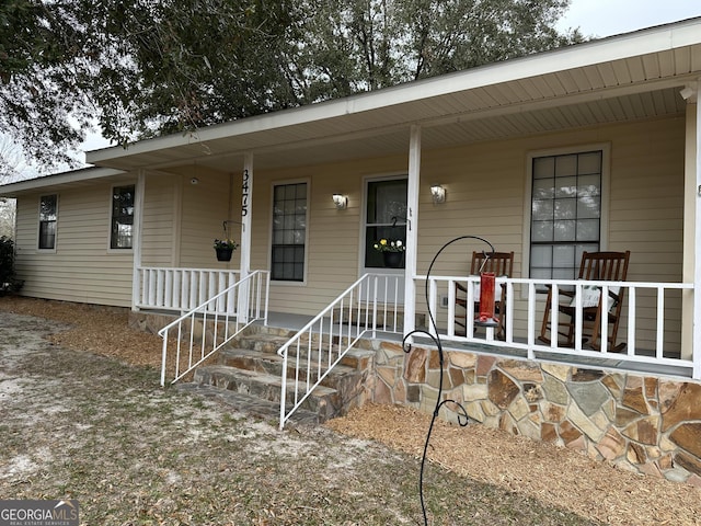 entrance to property with covered porch