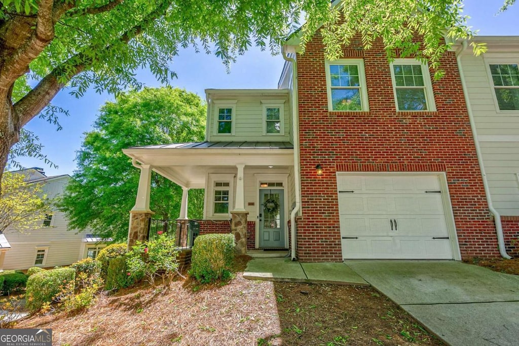 view of front of property with a garage and a porch