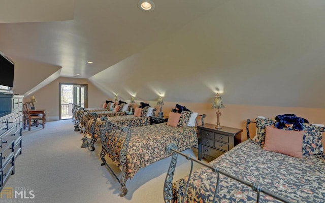 carpeted bedroom with vaulted ceiling