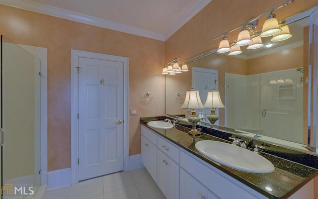 bathroom with vanity, ornamental molding, tile patterned floors, and walk in shower