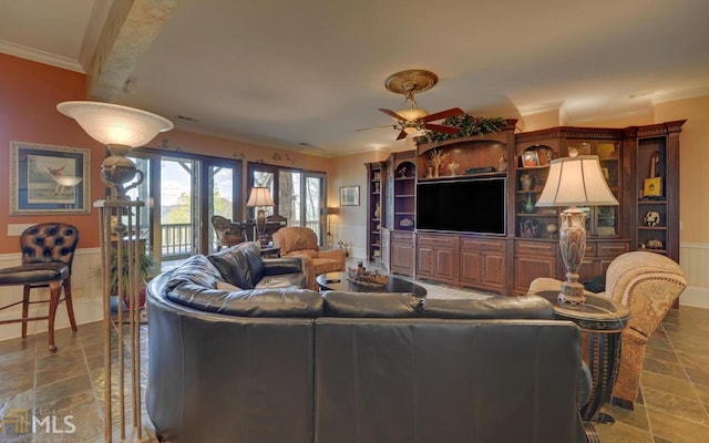 living room featuring ornamental molding and ceiling fan