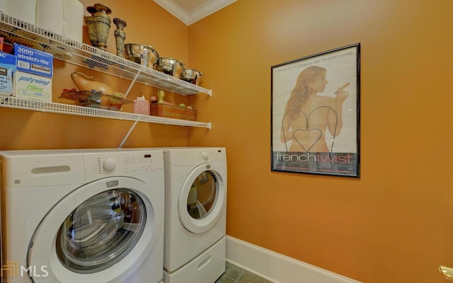 laundry room with crown molding, tile patterned flooring, and washer and dryer