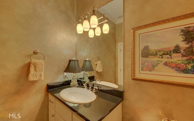 bathroom featuring vanity and crown molding