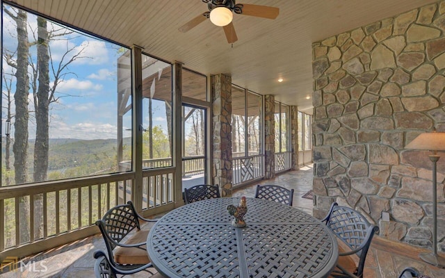 sunroom / solarium with wooden ceiling and ceiling fan